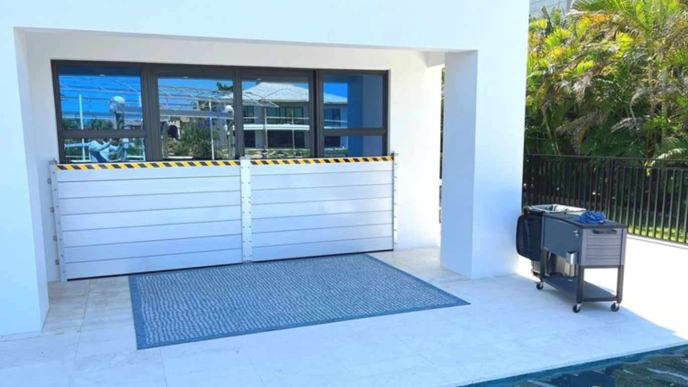 Make Flood Prep Fun with Aluminum Flood Plank Barriers Aluminum flood plank barriers installed for water protection near a poolside.